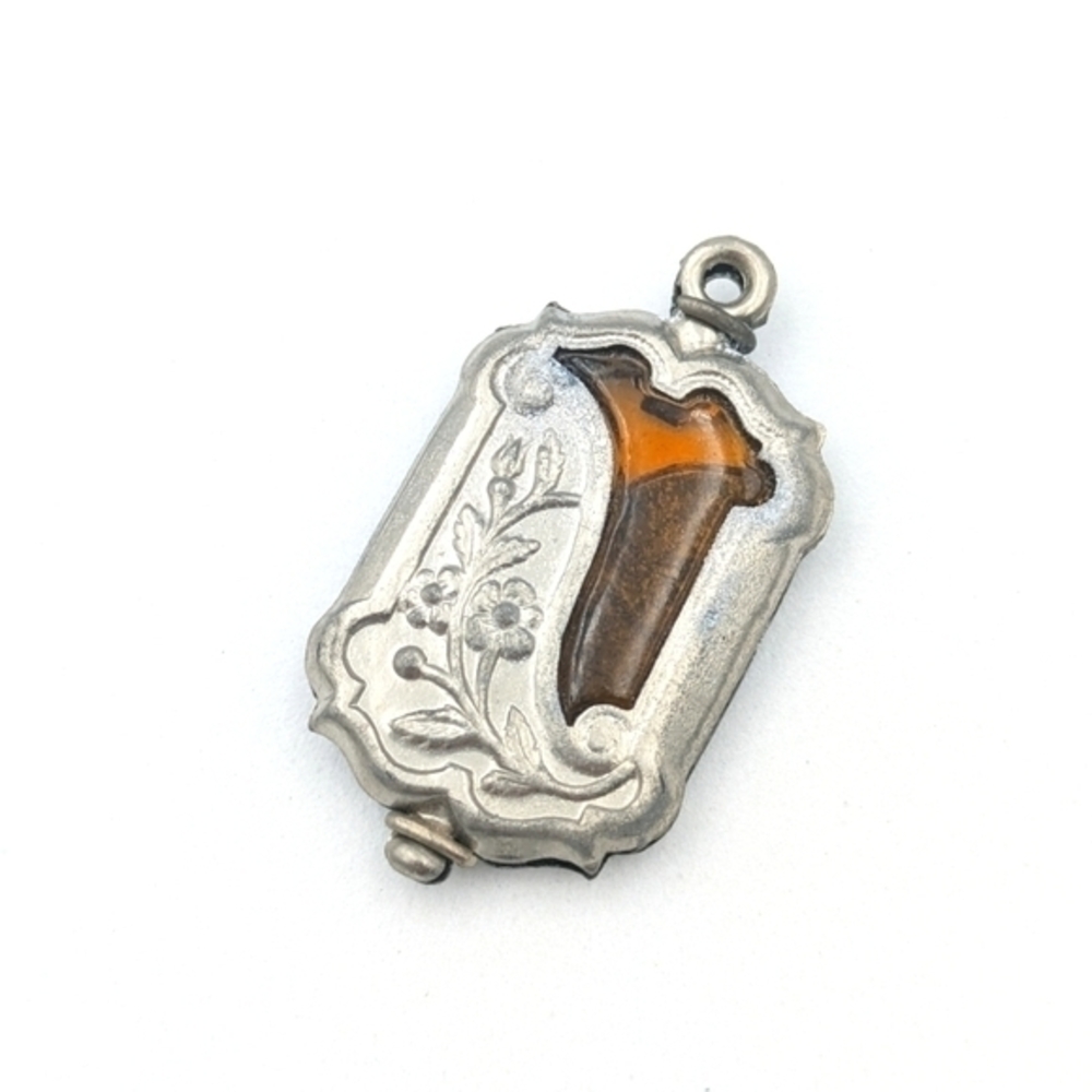 Antique Art Nouveau silver tone floral fob with amber glass insert